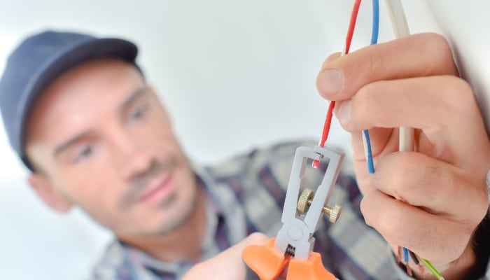 Electrician Snipping A Wire Electrician Snipping A Wire